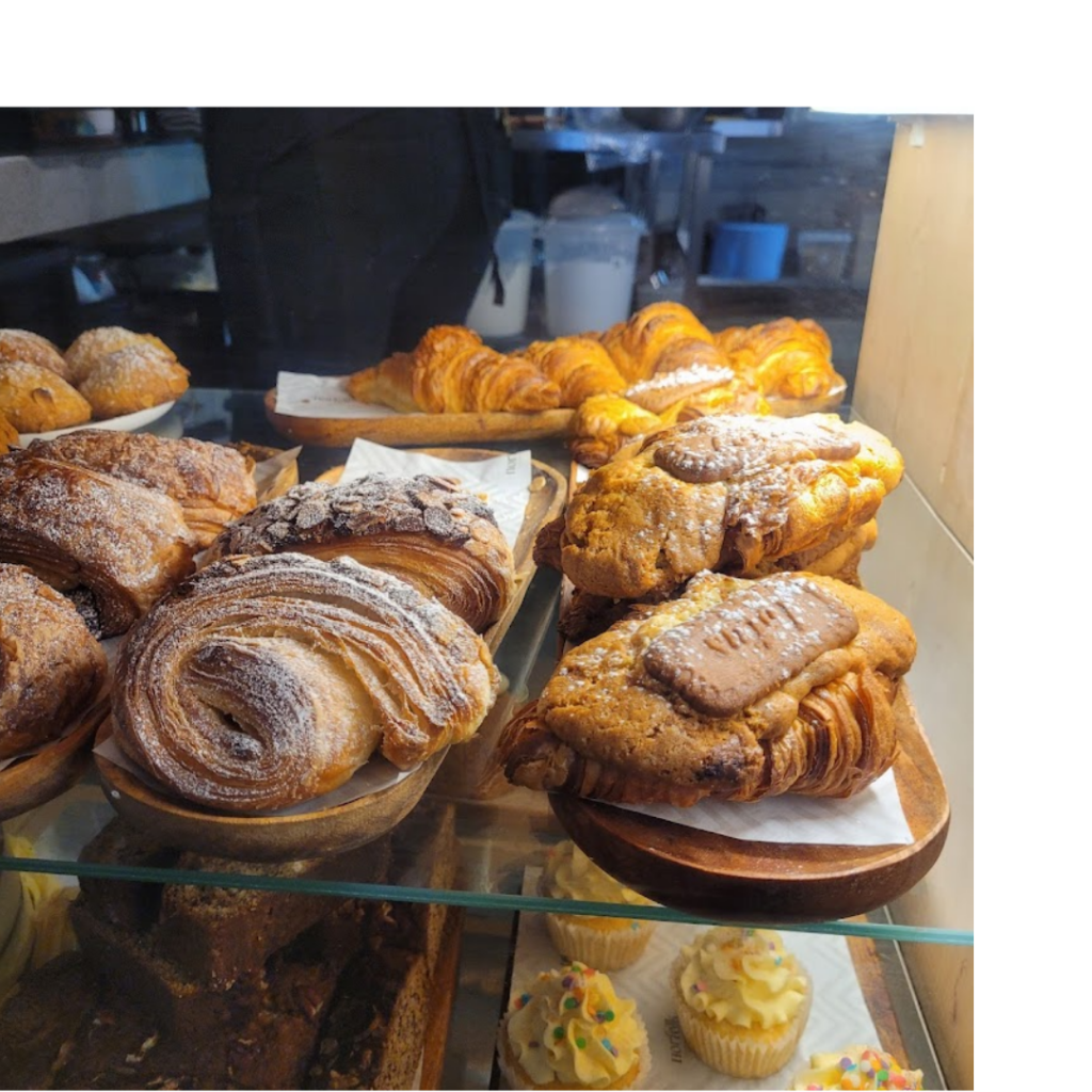 Delight in fresh sandwiches, cakes, and coffee at Norfolk Deli, a favorite spot near THREE43 ON B.