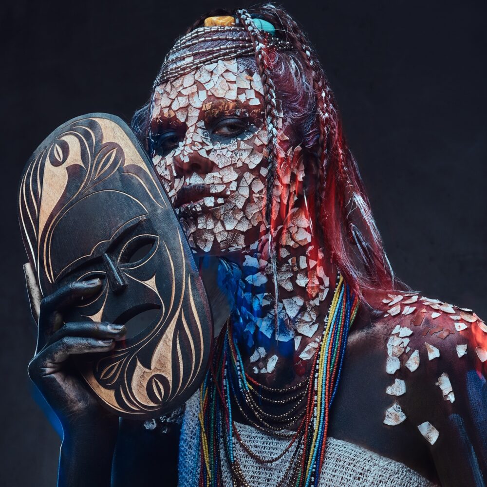 Portrait of a scary African shaman female with a petrified cracked skin and dreadlocks Portrait of a scary African shaman female with a petrified cracked skin and dreadlocks